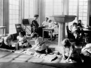 European Montessori classroom in 1925 showing children engaged in self-directed learning with authentic educational materials
